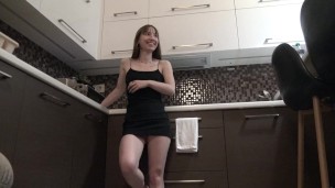Sexy and Horny Braless Brunette Petite Girlfriend in the Kitchen in a Very Tight Dress to flash pussy and ass